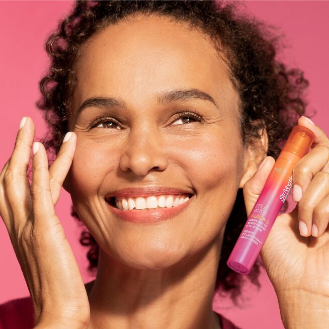 Woman using Super-C Dark Circle Brightening Eye Serum