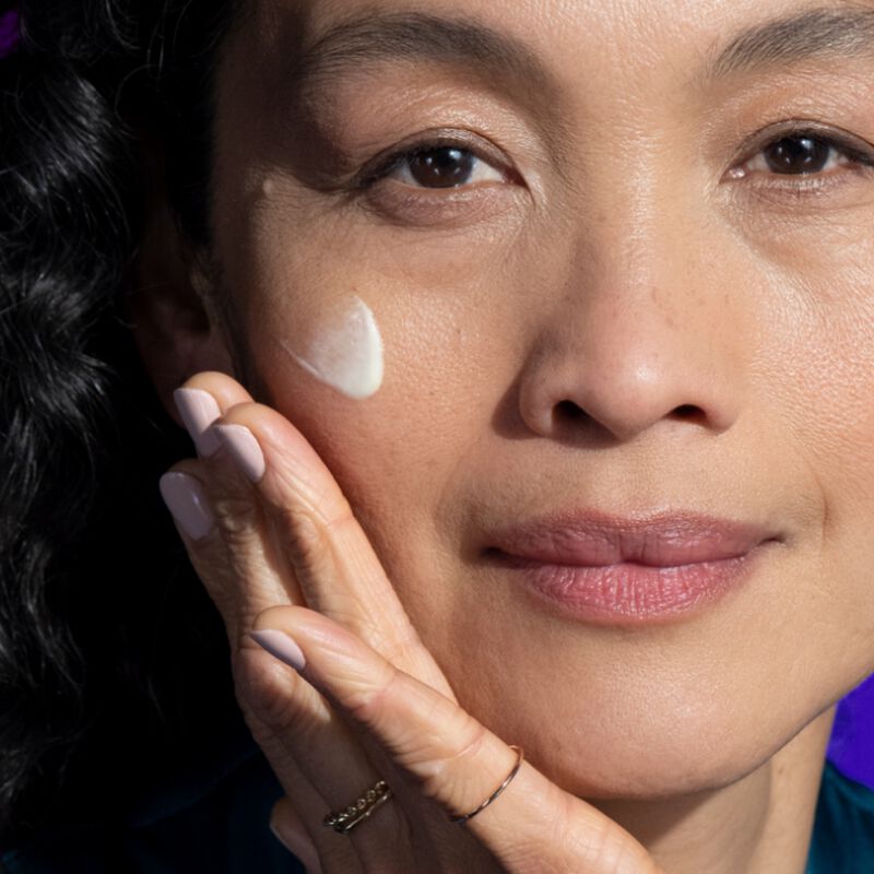 Woman with Advanced Retinol Nightly Multi-Correct Serum on her cheek